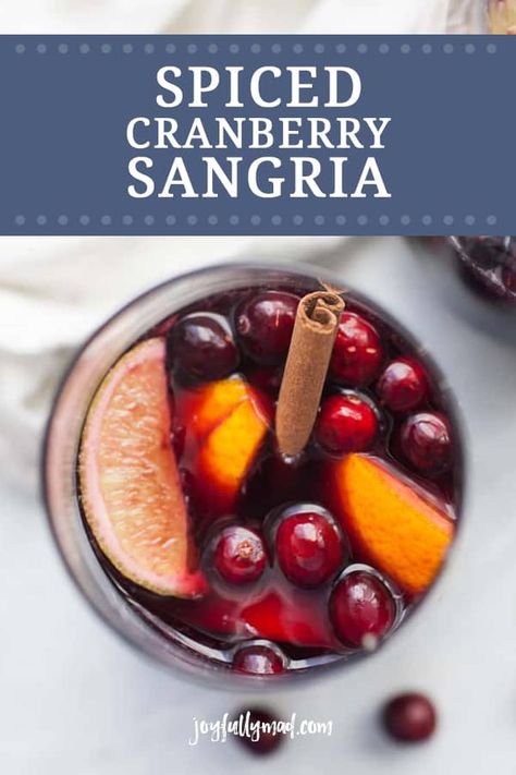 Spiced cranberry sangria is the perfect drink for celebrating this holiday season! This sangria is made with red wine, lime and orange juice, plus fresh cranberries, oranges, limes and cinnamon. Make a batch or a few and gather around with your favorite people to celebrate the season! Cranberry Sangria, Cranberry Simple Syrup, Holiday Sangria, Blender Drinks, Pitcher Cocktails, Thanksgiving Appetizers Easy, Healthy Cocktails, Easy Drink Recipes, Best Cocktail Recipes