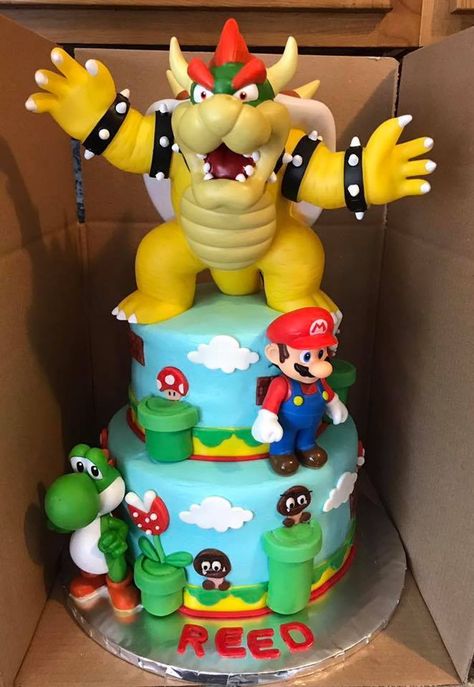 Super Mario Brothers Super Mario Brothers cake with toy characters and fondant accents. Mario Birthday Cake No Fondant, Super Mario And Bowser Cake, Super Mario Lego Cake, Mario And Bowser Birthday Cake, Bowser Birthday Party Cake, Super Mario Cake Bowser, Super Mario Movie Cake, Super Mario Theme Cake, Mario And Bowser Cake