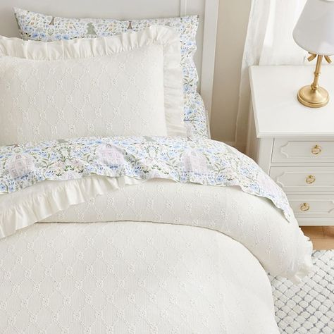 Add dreamy detail to their sleep space with our Nina duvet cover and shams. Embellished with a softly textured trellis and edged in satin ruffles, they come in versatile solid colors that layer beautifully with their favorite sheeting. DETAILS THAT MATTER Made of 99% polyester and 1% spandex dobby weave. Duvet reverses to a 100% cotton design. Twin size duvet is finished with 4 corner ties and 6 buttons to keep duvet in place. Full/Queen duvet is finished with 4 corner ties 8 buttons to keep duvet in place. Shams features an envelope closure. OEKO-TEX(R) STANDARD 100: tested for 1000+ harmful substances to keep you and your family safe. 21.HUS.86232 HOHENSTEIN HTTI. By choosing our cotton products, you're supporting our investment in Better Cotton's mission. This product is sourced via mas Ruffle Duvet Cover, College Bedroom, Coastal Room, Kids Duvet, Kids Duvet Cover, White Duvet Covers, Girly Room, Cloud Dancer, Room Redo