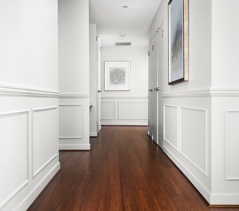 A hallway is an experience – a quiet journey that connects spaces, creating a flow throughout your home. It’s not just a transitional area; it’s a path that sets the tone, directing you where to go and how to feel as you move through it. Now, let’s talk about wainscoting. It’s not just about adding a decorative feature; it’s about bringing that hallway to life. With wainscoting, the walls aren’t just there to hold up the roof – they become part of the journey, Adding depth, character, And... Wainscoting Small Hallway, Wainscoting Hallway Ideas, Hallway Molding Ideas, Hallway Wainscotting, Wainscoting Hallway, Wainscoting Ideas, White Wainscoting, Small Hallways, Wainscoting