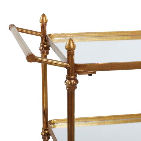 "Brass Iron Bar Cart This rectangular brass rolling cart is an amazing home storage item to place on living room or office room areas. Looks stylish in your living room or kitchen as a serving tray or as a decor stand. An optimal mobility piece of furniture that will show to wow your guests for any occasion. This item comes shipped in one carton. Suitable for indoor use only. Some assembly required. A traditional rolling storage cart featuring 3 shelves with 25. 50”W, 15. 50” depth, and 20 lbs. Vintage Bar Cart Styling, Bar Lounge Room Ideas, Unique Bar Cart, Dinning Room Bar, Bar Cart Inspiration, Bar Lounge Room, Nautical Bar, Brass Bar Cart, Rattan Bar Cart