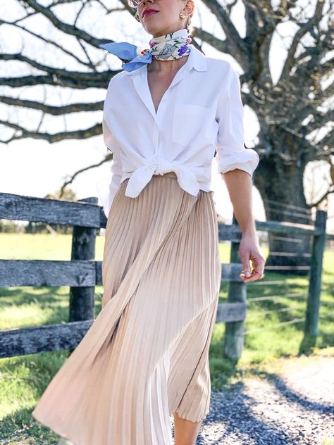 Romantic Shirt Outfit, Button Down Shirt With Pleated Skirt, Scarf Spring Outfit, Pleated Silk Skirt Outfit, White Silk Scarf Outfit, Spring Skirts 2023, Beige Pleated Skirt Outfit Summer, Silk Scarves Outfits, Silk Pleated Skirt Outfit