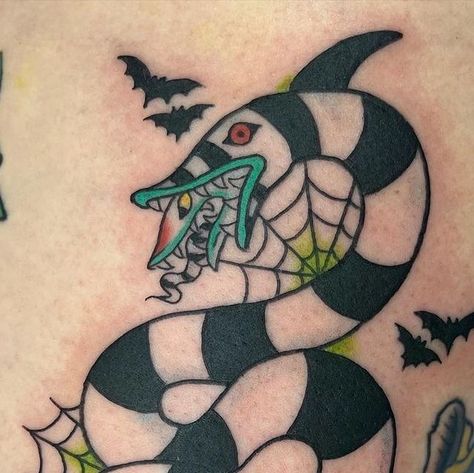 Ravens Claw Tattoo on Instagram: "Super fun sandworm done by Mariah 🦇 @riffraff.tattoos  . . . . . . . . . . . . . #sandworm #beetlejuice #beetlejuicemovie #beetlejuicetattoo #sandwormtattoo #halloween #halloweentattoo #spookyseason #traditionaltattooartist #253 #ravensclawtattoo #tacomatattooer #tacomatattoo #gritcity #ladytattooer #traditonal  #traditionaltattooer #traditionaltattoo #stencil #tattooflash #flashdrawing #traditionalartist #flashdrawing #tattoosofinstagram #tattoooftheday" Beetlejuice Bob Tattoo, Sandworm Pumpkin Carving, Sandworm Pumpkin, Sand Worm Tattoo, Sand Worm Beetlejuice Drawing, Traditional Voodoo Doll Tattoo, Beetlejuice Sandworm Drawing, Beetlejuice Snake Tattoo, Sandworm Drawing