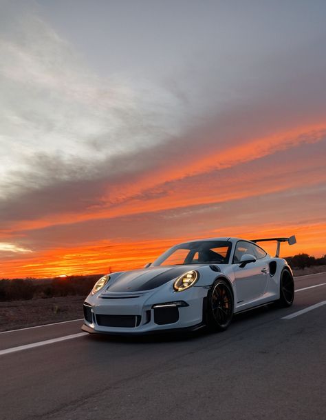 A white Porsche 911 GT3 RS parked on a road with a stunning sunset in the background. Porshe 911gtr, Porsche 911gt3rs, Visualization Manifestation, Porsche Gt3 Rs, Western Wallpaper, Fiery Sunset, Car Dream, Western Wallpaper Iphone, Ferdinand Porsche