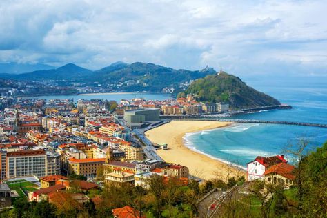 San Sebastian, Spain When travelers visit Spain, they usually flock to popular metropolises of Madrid, Barcelona and Valencia or to well-known beach hangouts like Ibiza. But the seaside community of San Sebastian offers a unique blend of beautiful, less crowded beaches and a glimpse at the unique Basque culture. Visitors can partake in a local food experience by sampling the Basque version of tapas, called pintxos, or dining at Michelin-starred restaurants. Best Cities In Europe, Spain Tour, Spain Itinerary, Spain Culture, San Sebastian Spain, Northern Spain, Basque Country, Most Beautiful Cities, San Sebastian