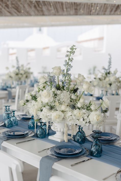 Lifetime Affair | Wedding Planners in Fira Dusty Blue Wedding Theme Bridesmaid, Spring Wedding Navy Blue Color Schemes, White And Navy Wedding Table, Blue Theme Table Setting, White Wedding With Hints Of Blue, French Blue Wedding Table Setting, French Blue Wedding Theme, Blue And White Floral Arrangements, Baby Blue Wedding Theme