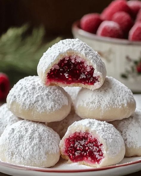 Raspberry-Filled Almond Snow Cookies – Festive Treat Raspberry-filled Almond Snow Cookies, Raspberry Filled Almond Cookies, Raspberry Filled Snowballs, Raspberry Almond Filled Snowball Cookies, Christmas Raspberry Cookies, Raspberry Meltaway Cookies, Ricotta Almond Cookies, Sugar Cookie Cups Christmas, Raspberry Almond Snowball Cookies