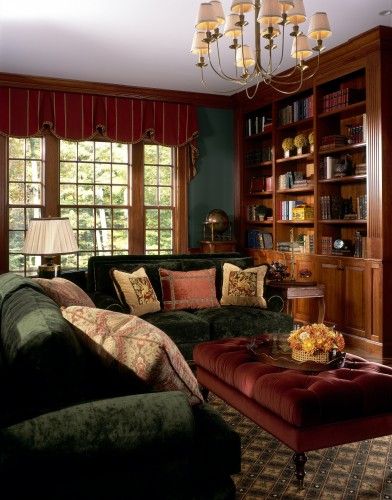 Interior Design Living Room Dark Wood, Green Library Living Room, Green Living Room Dark Wood, Dark Wood Green Living Room, Red And Olive Green Living Room, Red Orange Green Living Room, Cozy Dark Wood Living Room, Forest Green And Orange Living Room, Brown Green And Red Aesthetic