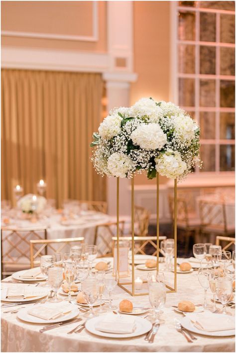 White Gold Wedding Reception Decor, Gold Stand Centerpiece Wedding, White And Gold Wedding Florals, Tall Gold Stand Centerpiece Wedding, Timeless Sweetheart Table, Tall White Centerpieces Wedding, Gold Stand Centerpiece, Tall Flower Centerpieces, Timeless White Wedding