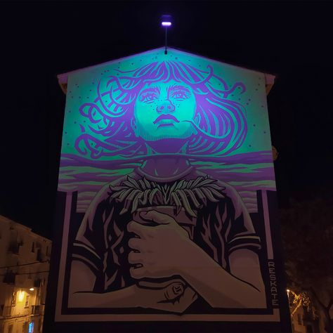 A photograph of a glow-in-the-dark mural at night, depicting a glowing image of a figure looking to the sky, clutching a potted plant to their chest. Dark Websites, Screen Print Poster, Colossal Art, Artist Collective, Visual Culture, Murals Street Art, Modern Crafts, Spanish Artists, Artist Websites