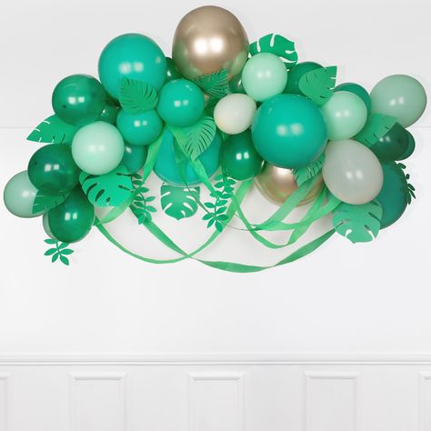 If you're looking for an on-trend statement party decoration, then this balloon arch is for you! With its wonderful mix of balloons, paper leaves and crepe paper streamers, it is the perfect backdrop for a safari or jungle party.  Balloons in solid green, crystal green, pastel green and shiny gold Crepe paper streamers in green and mint  Gold cord to hang the garland 20 paper leaves  PET balloon strip  Instruction sheet for simple assembly  Balloons can be used with or without helium Simple self Green Balloon Arch, Dinosaur Party Supplies, 16 Balloons, Dinosaur Balloons, Balloon Clouds, Crepe Paper Streamers, Bubblegum Balloons, Jungle Theme Parties, Paper Streamers