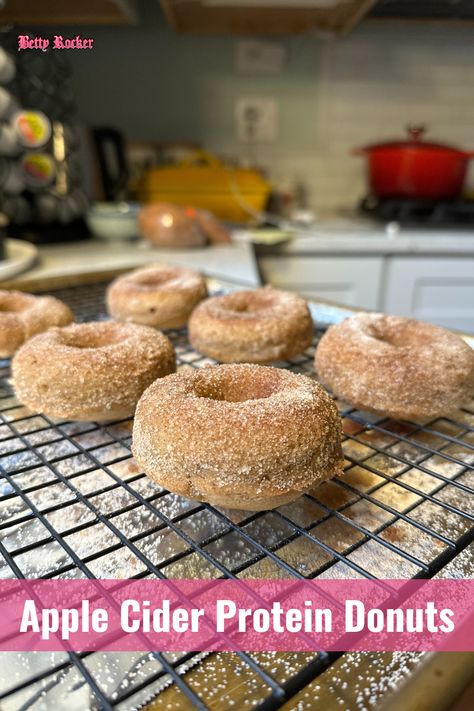 Just in time for Fall, we have Apple Cider Protein Donuts; gluten and dairy free, each serving of these donuts contains 22 grams of protein! Increasing our protein intake is a smart way to support the preservation of your muscle tissue, support your daily activities, and reduce sugar cravings. Protein is more satisfying than fat or carbs, so when we include it in our meals we aren’t as likely to overeat. ⭐️ Find this recipe on my blog ➡️ https://thebettyrocker.com/apple-cider-protein-donuts/ Protein Donuts Recipe, Kodiak Cakes Recipe, Betty Rocker, Protein Donuts, Protein Cake, Donuts Recipe, Kodiak Cakes, Protein Powder Recipes, Protein Desserts