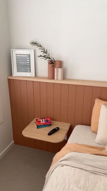 Surround by Laminex on Instagram: "This stunning project by @hammerandstone_workroom features our timeless Classic VJ 100 profile painted in @duluxaus Clay Court as a wall to wall bed head with a decorative ledge - Perfect for adding finishing touches to complete the space. Easy to install and ready to paint, this single wall feature adds so much depth and texture to this bedroom. Spruce up your room this Spring with Surround by Laminex. Love this look? Visit the link in our bio for more inspir Bedroom Feature Wall Behind Bed, Half Wall Ledge Bedroom, Picture Ledge Headboard, Diy Feature Wall Ideas Bedroom, Bed With Ledge Behind, Built In Ledge On Wall, Entire Wall Headboard, Headboard Ledge Wall, Bed Head With Shelf