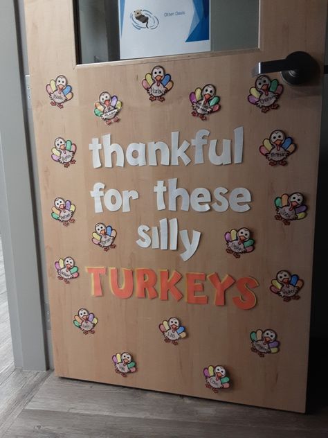 Door Art Preschool, Thanksgiving Door Decorations Classroom Turkey, Small Daycare Classroom Setup, November Daycare Bulletin Boards, Thanksgiving Decorations For Daycare, Fall Decorations For Preschool Classroom, New Year Daycare Door, Fall Thanksgiving Classroom Door, Thanksgiving Class Door Decorations