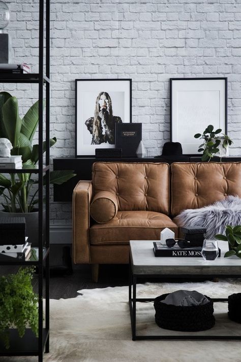 modern industrial living room with tan leather sofa and concrete coffee table Industrial Chic Interior, Cafe Industrial, Modern Industrial Living Room, Urban Industrial Decor, Tan Leather Sofas, Living Room Industrial, Furnitur Ruang Keluarga, Industrial Cafe, Cafe Chair