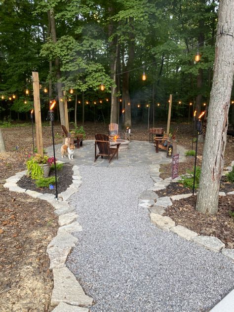 Backyard Campground Ideas, Cabin Fire Pit Ideas, River Rock Fire Pit Area, Clearing Out Wooded Backyard, Cabin Landscape Ideas, Southwestern Landscaping Ideas, Woodsy Backyard Ideas, Wooded Backyard Ideas, Woods Backyard Ideas