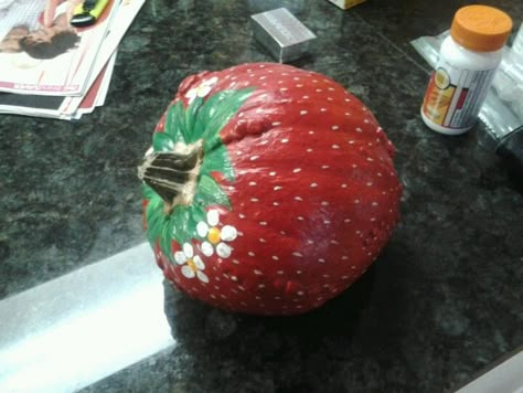 Pumpkin painted like a strawberry! Strawberry Pumpkin Decorating, Watermelon Pumpkin Painting, Strawberry Painted Pumpkin, Fruit Pumpkin Painting Ideas, Food Themed Pumpkin Decorating, Strawberry Shortcake Pumpkin Painting, Cheetah Pumpkin Painting, Kawaii Pumpkin Painting, Pumpkin Decorating No Carving