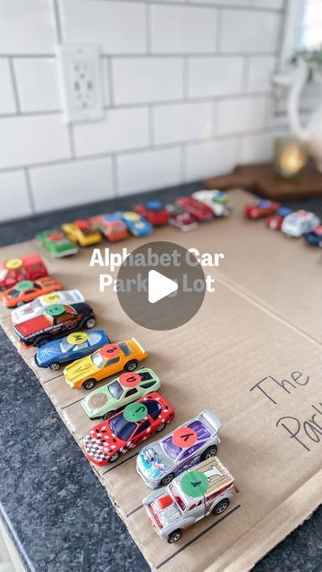 Katelyn Collier | That “Achievably Extra” Mom on Instagram: "Last time I posted this, it got a HUGE response. It’s without a doubt a fan favorite kids’ activity because it’s the best example of how play meets learning and vice versa.  My favorite activities are the ones where you get creative using what you already have. Simple ideas. BIG IMPACTS 👏🏼👏🏼  There’s so many different ways you can change up this activity. Instead of letters, use colors, numbers, or sight words. OR write addition problems on the stickers and have your kids park the cars on the sums! 🔢  Any other ideas??  #kidsactivities #kidsactivity #kidsactivitiesblog #teachermom #preschoolmom #homeschoolfun #homeschoolmama #learnathome #learningthroughplay #easyactivities #preschoolactivities #preschoolathome #toddlermoms" Preschool Tables, Goth Babe, Preschool Mom, All About Me Preschool, Teaching Game, Children Park, Diy Toddler, Teacher Mom, Easy Activities