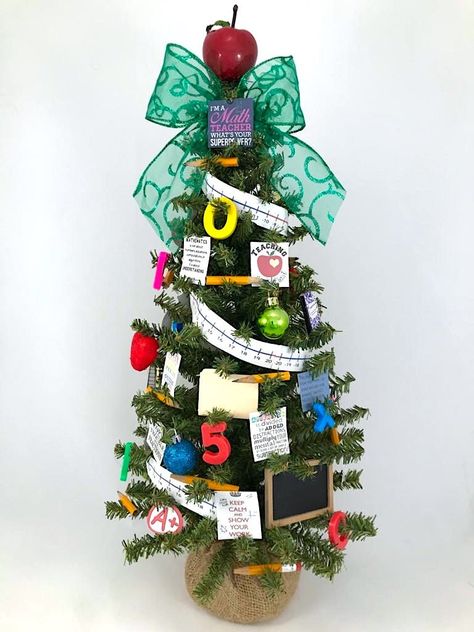 "You + this tree = Love!  This 24\" tree is especially made for an amazing math teacher.  Showing its work featuring a number line garland, mini chalkboard, red apple topper, and heartwarming and humorous quotes, this tree is perfect for the classroom for all to enjoy! Please note each of our trees and wreaths is individually and uniquely handcrafted and may sometimes have slight variations of ornaments and ribbon colors or designs.  *All trees come with a burlap base. Made in the U.S.A If you a Classroom Tree, Classroom Christmas, Humorous Quotes, Mini Chalkboards, Christmas Math, Christmas Classroom, School Themes, Number Line, School Math