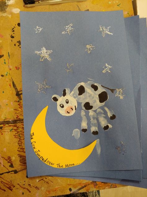 The Cow Jumped Over The Moon Craft, Cow Infant Art, Moon Footprint Craft, Nursery Rymes Crafts For Toddlers, Cow Jumped Over The Moon Craft, Mother Goose Crafts For Toddlers, Nursery Rhyme Crafts For Infants, Cow Jumped Over The Moon Nursery, The Cow Jumped Over The Moon