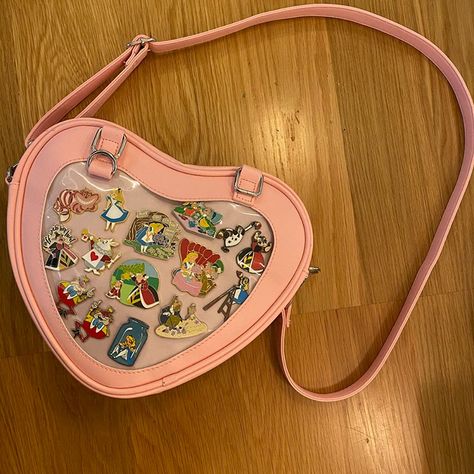 This Ita Bag Measures 11.5*8.7*2.5 Inch (Lxwxh).Weight:0.9pounds(0.410kg). This Pin Bag Have A Main Pocket And A Inside Zipper Pocket.Enough To Hold Smartphones, Keys, Wallets, Sunglasses. Come With An Ita Bag Insert.The Heart Shaped Clear Window Is Great For Showing Enamel Pins, Brooches,Badges,Buttons,Stickers And Small Aesthetic Items,But Would Not Damage The Structure Of This Heart Ita Bag. This Jk Uniform Ita Bag Come With A Shoulder Strap,Which Can Be Adjusted Freely.It Can Be Used As Ita Pins Display, Aesthetic Items, Pin Bag, Anime Pins, Ita Bag, Jk Uniform, Bag Insert, Clear Window, Zipper Pocket