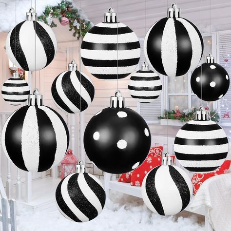 Big Porch Christmas Decor, Black And White And Gold Christmas Tree, Black And White Christmas Porch, Nightmare Before Christmas Tree Decor, Christmas Tree Ideas Black And Gold, Pink Black And White Christmas Tree, Fall Christmas Decor, Black Christmas Tree With Pink Ornaments, Oversized Outdoor Christmas Decorations