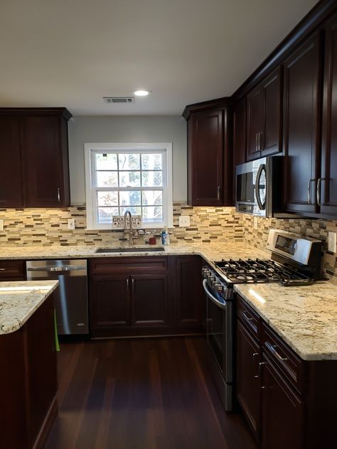 Brown Cabinets Black Appliances, Kitchen With Brown Wood Cabinets, Dark Red Wood Floors Living Room, Espresso Kitchen Cabinets Color Schemes Dark Wood Granite Countertops, Small Rectangular Kitchen Ideas, Kitchen Ideas Dark Wood, Cherrywood Cabinet Kitchen, Dark Wood Kitchen Floors, Brown House Interior