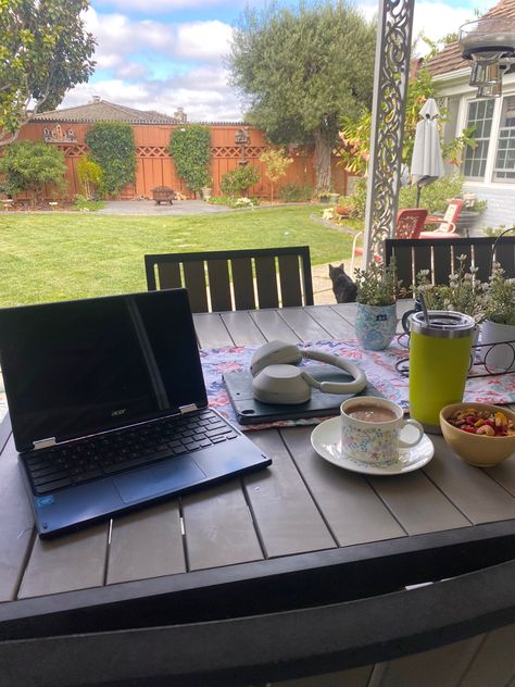 Aesthetic work/study set up on patio table with coffee, snacks, water, headphones, iPad, & laptop Yard Work Aesthetic, Ipad Headphones, Fruit Granola, Outside Aesthetic, Aesthetic Studying, Backyard Goals, Granola Aesthetic, Work Grind, Work Outside