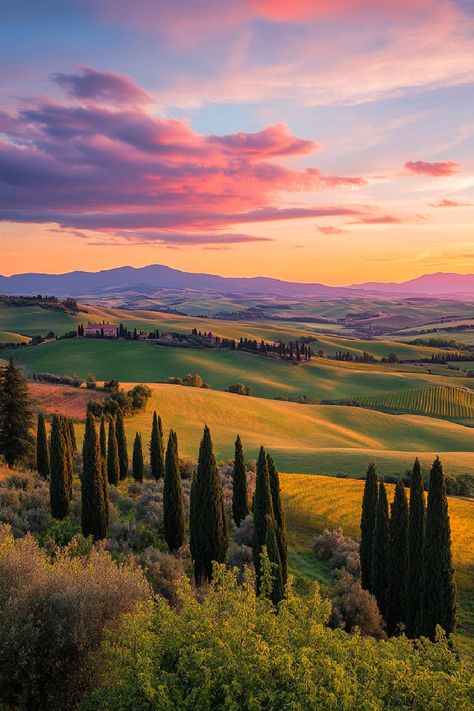 A breathtaking view of the rolling hills of Tuscany at sunset, featuring lush green fields, tall cypress trees, and a sky painted with vibrant shades of pink and orange. Tuscany Vineyard, Italy Countryside, Tuscany Travel, Sunset Landscape, Medieval Town, Tuscany Italy, Beautiful Places To Visit, Most Beautiful Places, Wonderful Places