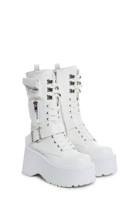 will have you winning every battle. These boots have a vegan leather construction, treaded wedge platform soles, zippered stash pockets on the sides, adjustable buckle detail, front lace-ups, and side zipper closures. Black And White Platform Boots, White Goth Boots, Bulky Boots, Doll Shoes Outfit, Platform Boots White, White Boots For Women, Preppy Boots, White Platform Boots, White Streetwear