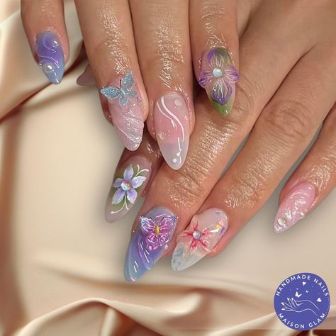 3D Floral & Butterfly Press-On Nails in Pastel Shades 🌸🦋 Bring your nails to life with this enchanting set of handcrafted press-on nails, featuring dreamy 3D florals, delicate butterflies, and soft pastel tones. This gorgeous set blends shades of lilac, pink, and blue with intricate 3D flowers and butterflies for a magical, garden-inspired look. 🌸 3D Floral Magic: With flowers and butterflies, stones and pearls these nails are 3D.  🎨 Pastel Perfection: Soft purple, pink, and blue hues create a whimsical, romantic feel. 💅 Almond Shape: The sleek almond shape gives your nails a graceful, elongated appearance. ✨ Set Includes: 10 nails + an easy application kit, ensuring a flawless, salon-quality finish at home. 🔄 Reusable & Long-Lasting: These beautiful nails are designed for repeat wea Flower Garden Nails, Gel Nails Pastel, Cristal Nails, Garden Nails, Nails Pastel, 3d Flower Nails, Airbrush Nails, Pearl Nails, Floral Butterfly