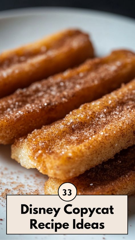 A close-up of a homemade Disney churro with cinnamon sugar, placed on a white plate, capturing the golden, crispy texture. Disney Park Recipes, Disney World Food Recipes, Disney Parks Recipes, Disneyland Copycat Recipes, Disney Dinner Ideas, Disney Themed Snacks, Disney Copycat Recipes, Disney Dessert Recipes, Park Snacks