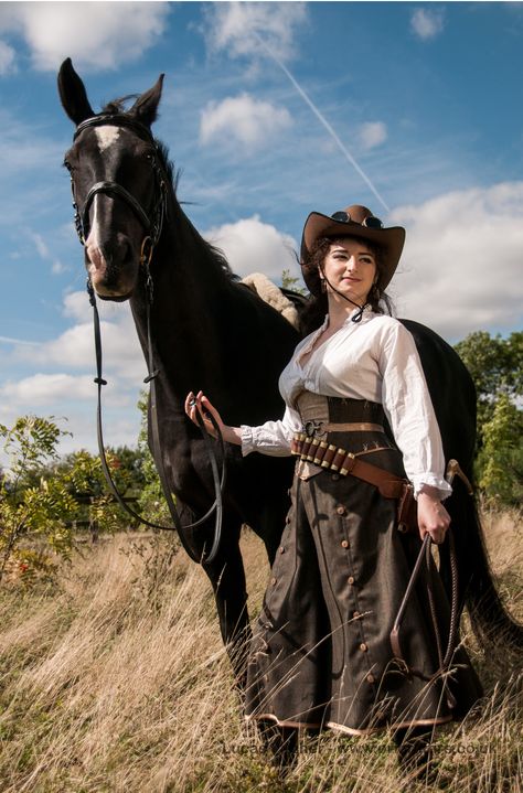 from the Prior Attire Steampunk Amazones collection - , Australian influence, Outback amazone. cotton blouse, wool and leather corset, .. wool riding skirt/trousers...re pics here:https://www.facebook.com/media/set/?set=a.494999160596328.1073741830.359653147464264=1 Cowboy Attire, Cowgirl Photography, Riding Skirt, Skirt Trousers, Cowboy Action Shooting, Plain People, Cowboy Costume, Steampunk Corset, Cowboy Outfits