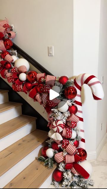 Jeanna Crawford on Instagram: "If this ribbon and garland isn’t giving candy cane lane then I don’t know what is ❤️😘  This full garland look is available to shop at the ShopWithJLC link in my bio 🎁  My giant candy cane is from Sullivans Faves & Candy Ornaments are from Vickerman Selects (You can use my code: QueenOfChristmas for both 🎁😘) . . . #christmas #christmasdecor #christmasdecorations #christmasdecorating #candycane #candycanes #christmasgarland #garland #staircasegarland" Candy Cane Garland Christmas Decor, Candy Cane Lane Christmas Decor, Candy Cane Garland, Candy Cane Tree, Giant Candy Cane, Christmas Staircase, Candy Cane Lane, Candy Cane Christmas Tree, Giant Candy