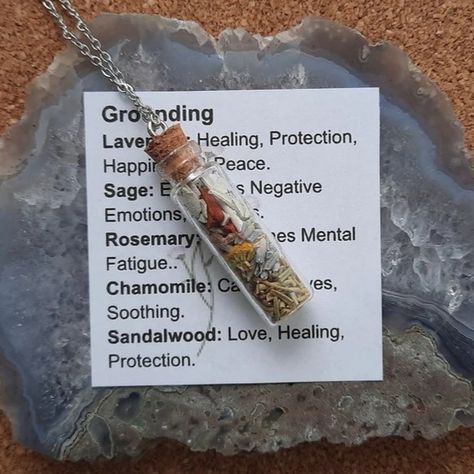 Grounding Spell Bottle Necklace. On sale now! Stop on by! https://nevermorekeep.etsy.com/listing/1714744537 Grounding Bottle - Manifestation Necklace. This Spell Bottle Necklace contains herbs and flowers chosen specifically for their metaphysical properties that promote Grounding. Helps to keep you in the "Here and Now". Let this Spell jar Necklace reconnect you to the present moment. Designed to help the wearer, made with love and infused with Reiki energy. #witchlife #smallbusiness #smal... Spell Jar Earrings, Spell Jar Necklace Diy, Spell Jar Necklace, Small Jar Necklace, Spell Bottle Necklace, Tiny Spell Jar Necklace, Reiki Energy, Bottle Necklace, Loom Weaving