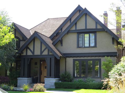 English Tudor with Stucco.  Dark brown trim with beige background. Tudor Revival House Exterior, Dark Exterior House, Tudor House Exterior, Cottage Colors, Exterior Color Palette, Dark Trim, House Trim, Stucco Homes, Home Exterior Makeover