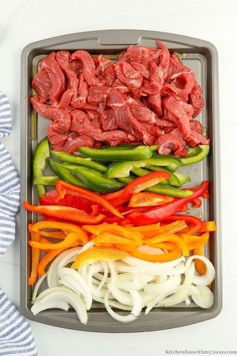 Fajitas are one of my favorite meals and are sure to become yours with this recipe. This Sheet Pan Steak Fajitas recipe is so good and will feed your whole family. With a few simple ingredients, you will have a delicious meal ready to serve in no time. One Sheet Pan Fajitas, Sheet Pan Flank Steak Fajitas, How To Cook Fajita Meat, Sheetpan Fajitas Beef, Steak Fajita Casserole Recipe, London Broil Fajitas, One Pan Fajitas, Sheet Pan Beef Fajitas, Fajitas Steak