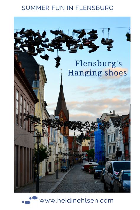 There are hundreds of shoes hanging on wires strung between the house gables in the old town of Flensburg, Germany. Click to find out why. Flensburg Germany, Shoes Hanging, Germany Berlin, Hanging Shoes, Cities In Germany, Old Cemeteries, Maritime Museum, Sailing Yacht, West Indies