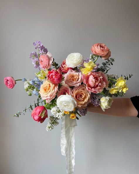 Spring bridal bouquet with tulips, ranunculus and garden roses Bouquet With Tulips, Ranunculus Bridal Bouquet, Ranunculus Wedding Bouquet, Spring Bridal Bouquet, Ranunculus Wedding, Garden Rose Bouquet, Colorful Bridal Bouquet, Wedding Flowers Tulips, Ranunculus Bouquet