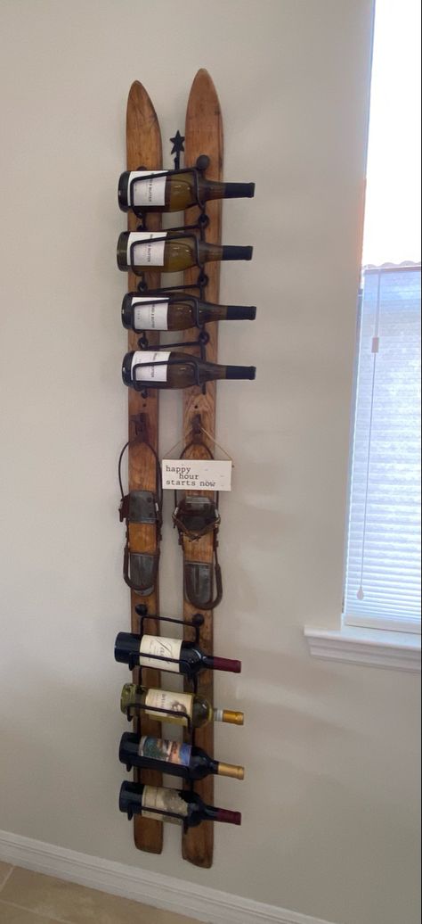 Old wooden skis turned into a wine rack. Ski Wine Rack, Ski Display Ideas, Old Snow Skis Ideas, Ski Themed Living Room, Old Ski Decor Ideas, Skis On The Wall, Ski House Decor Interiors Cozy, Repurpose Old Skis Ideas, Old Wooden Skis Ideas