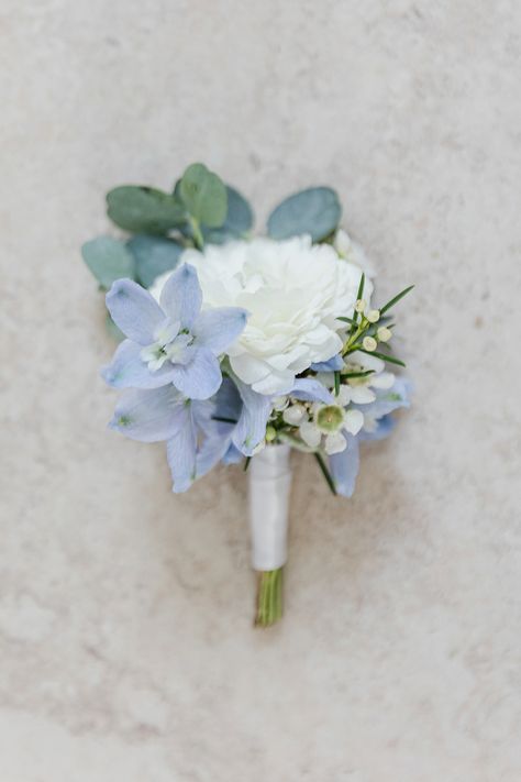 Green And Blue Boutonniere, Powder Blue Boutonniere, White Ranunculus Blue Delphinium Boutonniere, Mountain Wedding Flowers Summer, Light Blue And White Corsage And Boutonniere, Dusty Blue And Sage Green Boutonniere, White And Blue Flower Boutonniere, White And Blue Wedding Flowers Bouquets, Light Blue And White Boutonniere