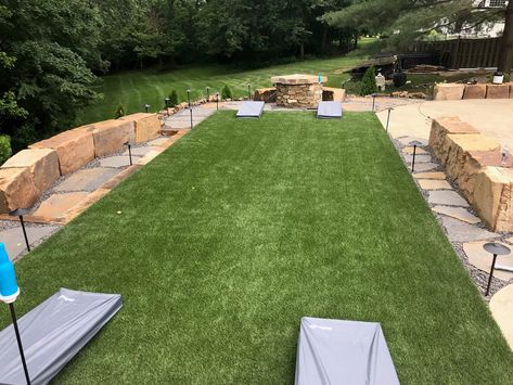 Who doesn't love a game of backyard cornhole? No matter what activities you enjoy in the backyard, we take the time to listen to your needs so we can make the right recommendations for each project. Contact us online for a free quote. . . . . #synlawn #mysynlawn #synlawnusa #artificialgrass #artificialturf #artificiallawn #syntheticturf #syntheticgrass #syntheticlawn #landscapedesign #landscapearchitecture #landscapearchitect #homeimprovement #petturf #petfriendly #kidfriendy #cornhole Turf Backyard Cornhole, Backyard Yard Game Area, Backyard Corn Hole Court, Cornhole Outdoor Area, Outdoor Corn Hole Area, Outdoor Gaming Area, Backyard Corn Hole Area, Corn Hole Area In Backyard, Outdoor Game Area Backyard Ideas