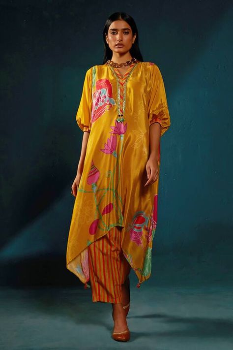 Yellow asymmetric kaftan kurta with floral print, sequin embroidered neckline. Paired with a striped pant. - Aza Fashions Printed Kaftan Designs, Printed Kurta Designs Women, Asymmetrical Kurti, Kaftan Patterns, Kaftan Kurta, Simple Kurta, Kaftan Pattern, Basil Leaf, Guru Ji