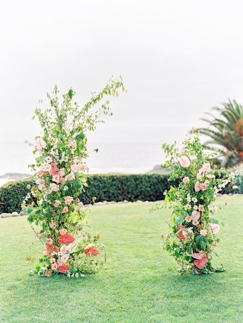 Unfinished arbor ceremony arch with greenery, pink, and berry-toned flowers with an asymmetrical design and an ocean backdrop. Coastal Montage Laguna Beach Wedding Editorial by Cavin Elizabeth on film Coastal Wedding Inspiration, Tropical Scenery, Floral Arches, Montage Laguna Beach, Beach Wedding Reception, Romantic Backdrop, Beach Wedding Inspiration, Wedding Beach Ceremony, Beach Ceremony