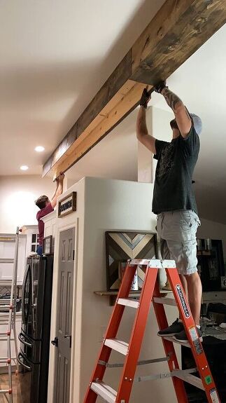 Cover A Beam With Wood, Inexpensive Wood Wall Ideas, Steel Beam Cover Ideas, Plank Accent Wall Living Room, Cover Beam Ideas, Pine Beams Ceiling, Adding Beams To Ceiling, Adding Wood Beams To Ceiling, Faux Beams Living Room