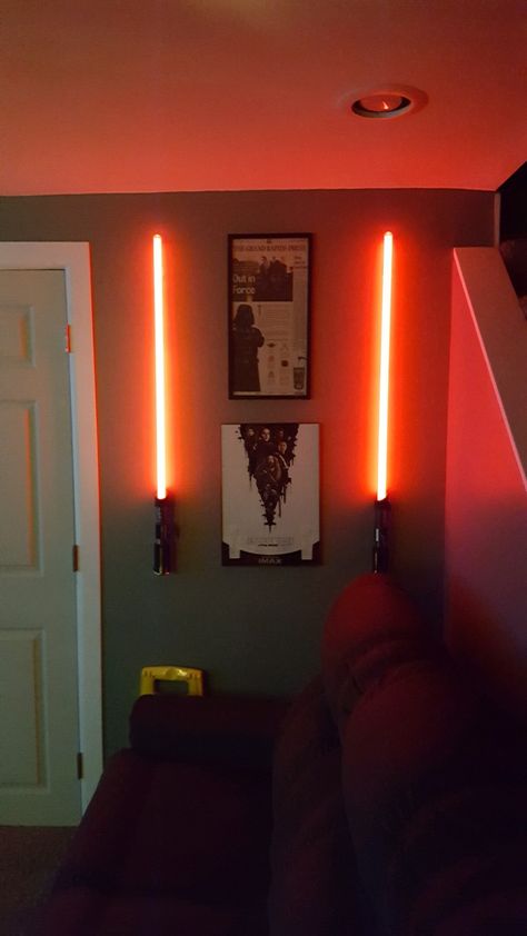 Lightsaber display Starwars Decorations Room, Star Wars Lightsaber Wall Display, Lightsaber Decor, Lightsaber Display Wall, Lightsaber Display Ideas, Star Wars Interior, Star Wars House Decor, Star Wars Living Room, Unique Man Cave Ideas