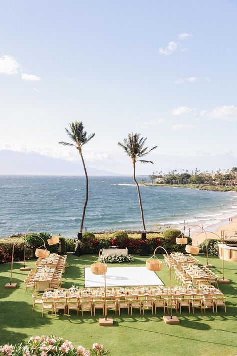 Modern garden vibes made this Maui wedding one for the books! With all-white fashion and adorable details to match the breathtaking venue's natural features, this wedding was sheer perfection! See the link in our bio for an even deeper look! Oahu Wedding Reception, Pink Tablecloths, Four Seasons Maui, White Wedding Table Setting, Maui Destination Wedding, Sunset Backdrop, Wedding Venues Hawaii, Oceanfront Wedding, Maui Beach