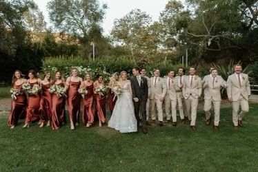 Wedding Party Photos Terracotta, Copper And Tan Wedding Party, Men’s Wedding Party Suits, Boho Fall Wedding Groomsmen, Terracotta Themed Wedding, Rustic Wedding Terracotta, Rust Wedding Party Bridesmaid Dress, Terracotta And Green Wedding Theme, Terracotta Bridesmaid Dress With Groomsmen