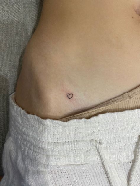 Tiny heart tattoo on hip Heart On Hip Tattoo Simple, Small Hip Bone Tattoos Women, Hip Stick N Poke, Mini Stick N Poke, Pelvic Tattoo Hip Small Heart, Subtle Heart Tattoo, Stick And Poke On Hip, Tiny Pelvic Tattoo, Dainty Tattoos Ribs