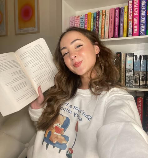 i do in fact have a book for every situation 🤍 love this bookish sweatshirt from @talesandthreadsco 🫶🏻📖🎀 • • • #booksta #books #bookish #bookishmerch #aesthetic #bookstagram #booktuber #booktube #reader #booklover How To Pose With Books, Cozy Reader Aesthetic, Bookstagram Pose Ideas, Aesthetic Pics With Books, Bookish Photoshoot Ideas, Bookstagram Selfies, Bookish Photo Ideas, Book Photoshoot Ideas At Home, Selfies With Books